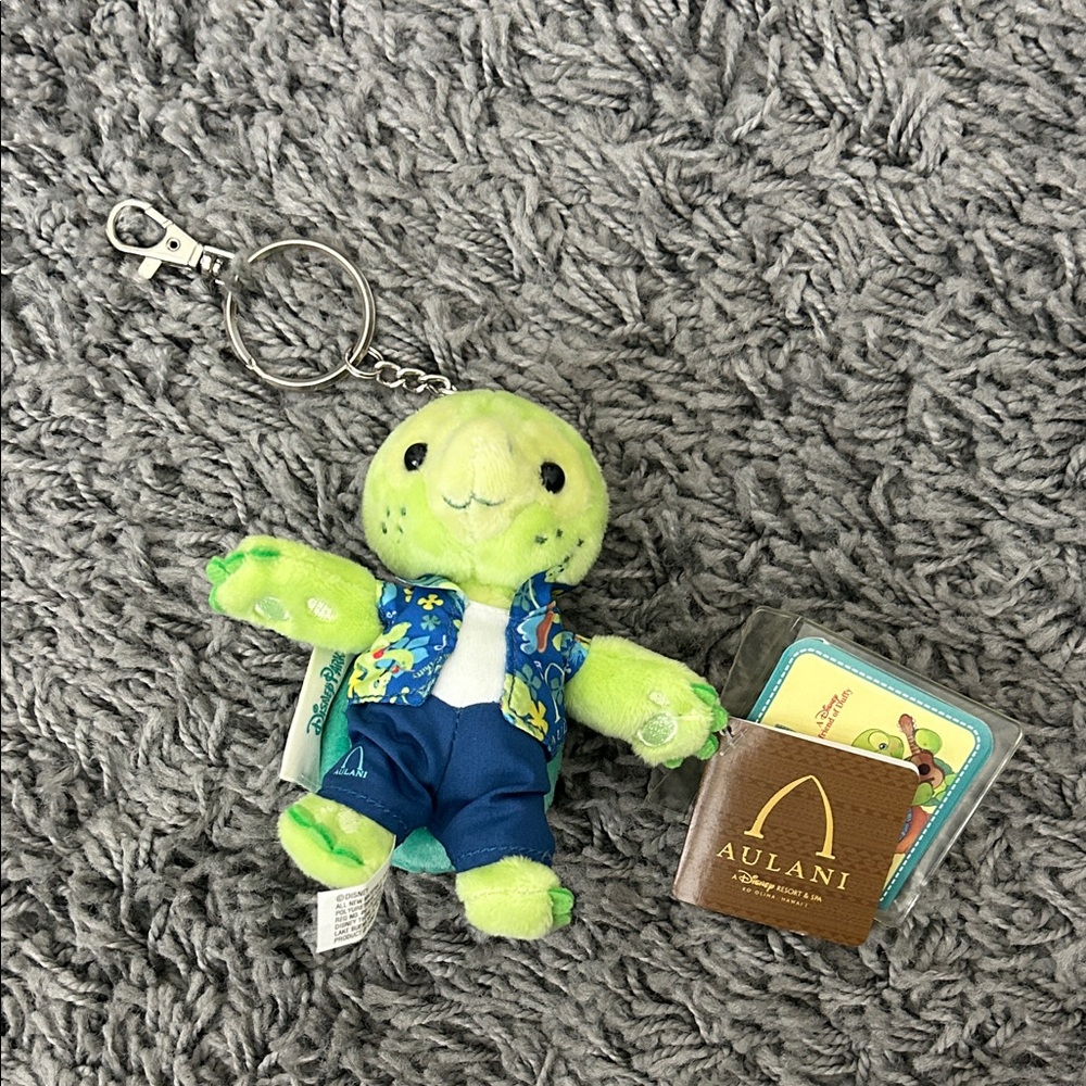 Disney Aulani Resort Olu Mel Keychain Plush Green Turtle Plush with Blue Outfit